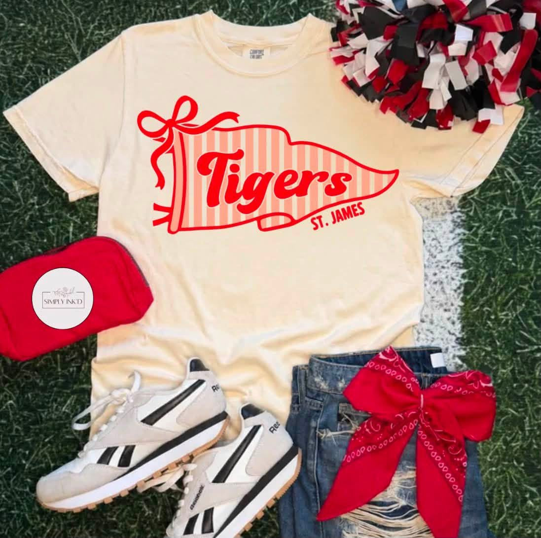 St. James Tigers striped pennant design shown on an ivory T-shirt