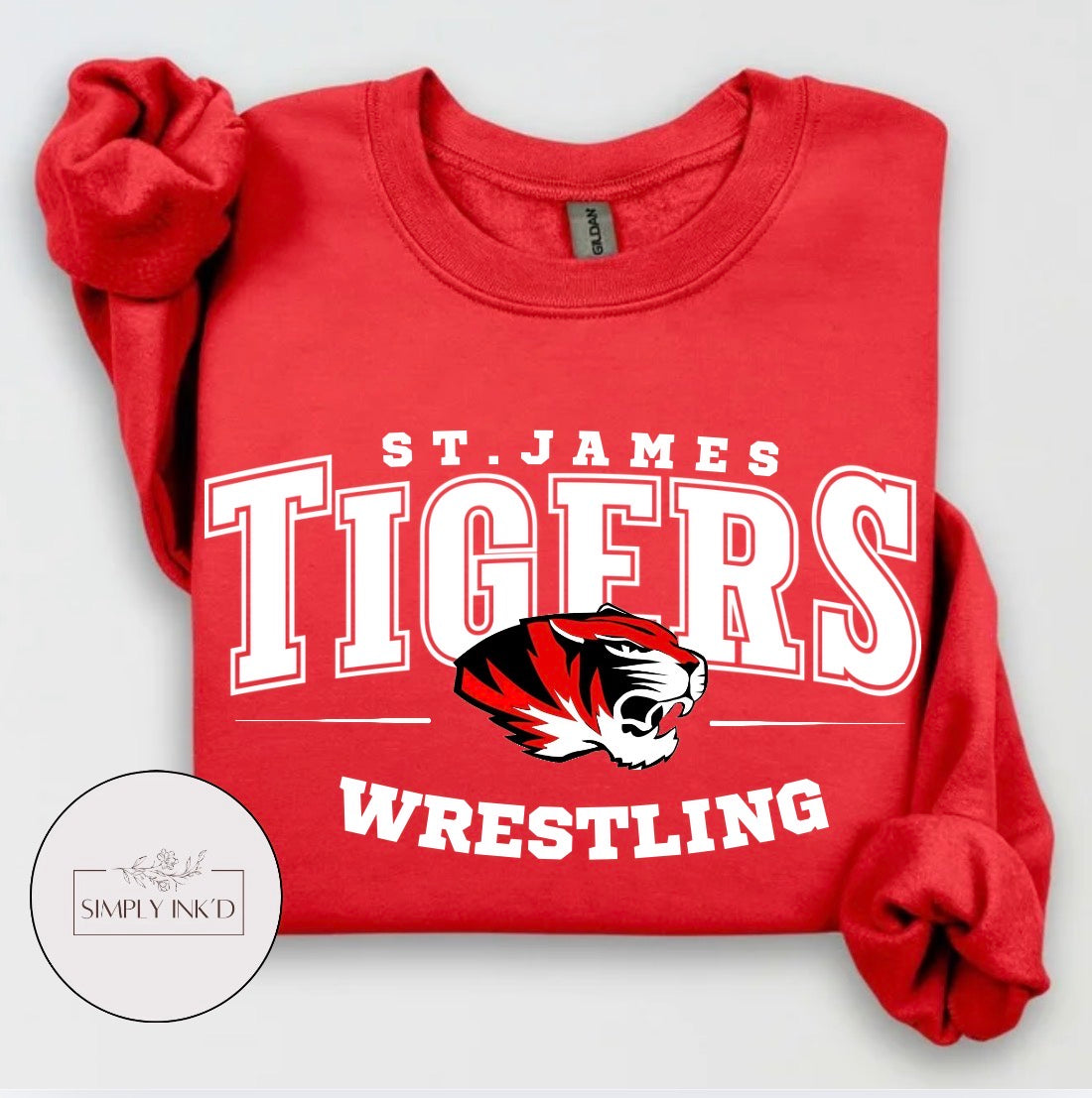 St. James Tigers Wrestling design on a red crewneck sweatshirt