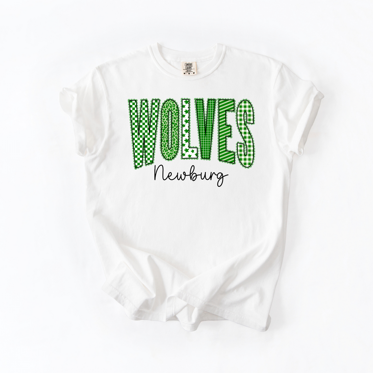 Green patterned WOLVES lettering and black Newburg script on white T-shirt