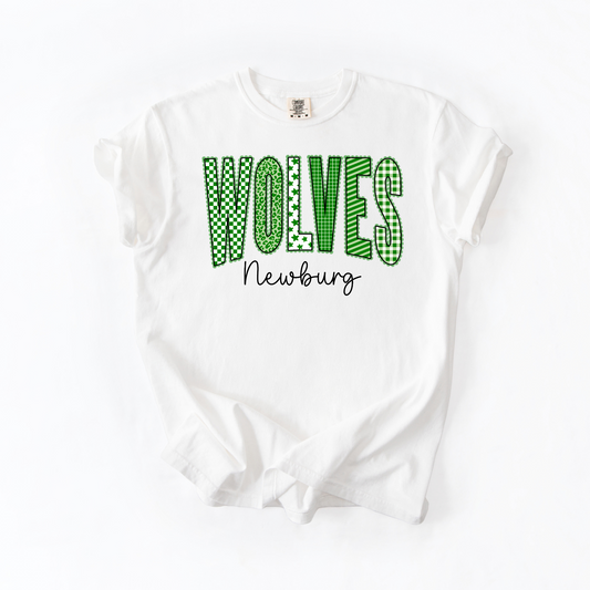 Green patterned WOLVES lettering and black Newburg script on white T-shirt