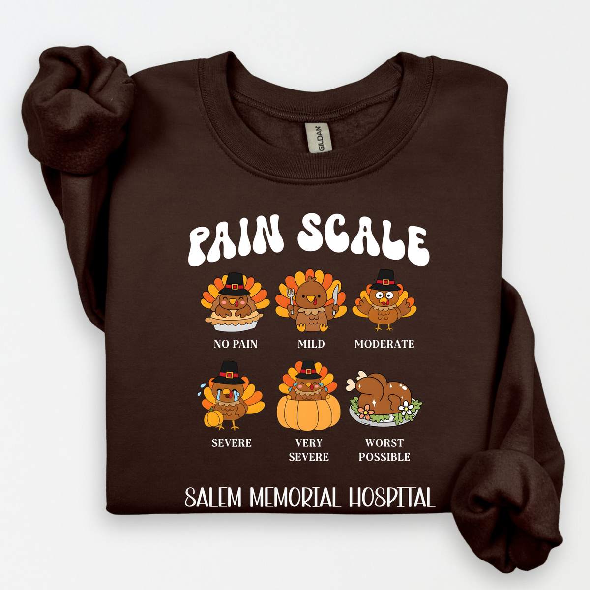 Thanksgiving turkey Pain Scale design with Salem Memorial Hospital lettering on a dark brown crewneck sweatshirt