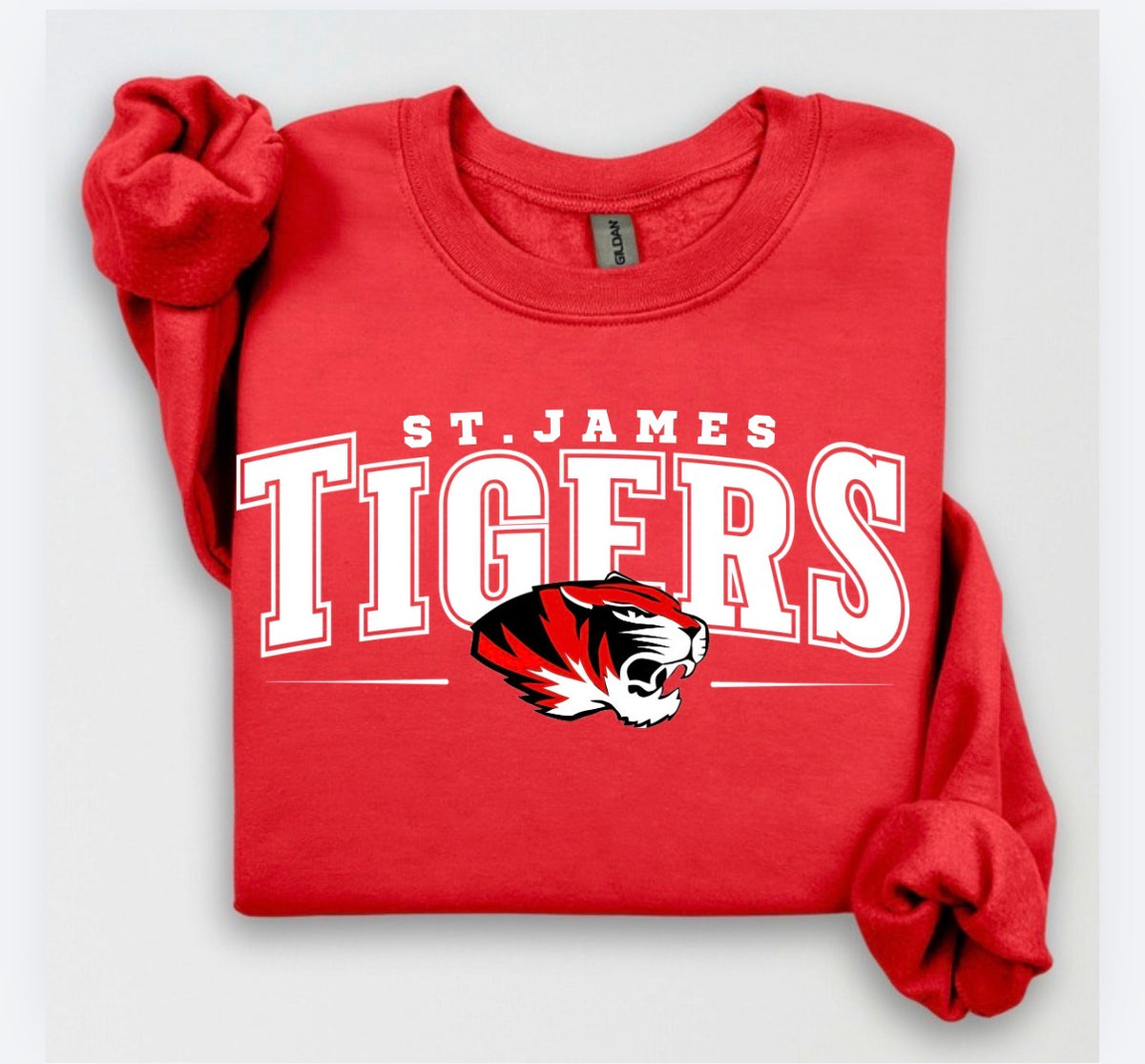 St. James Tigers classic design on a red crewneck sweatshirt